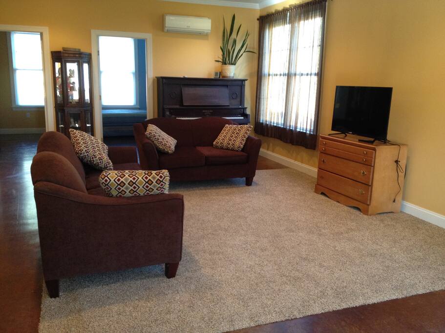 We have a large living room area with wifi and satellite TV. Enjoy lots of sunlight through the windows in the morning hours!