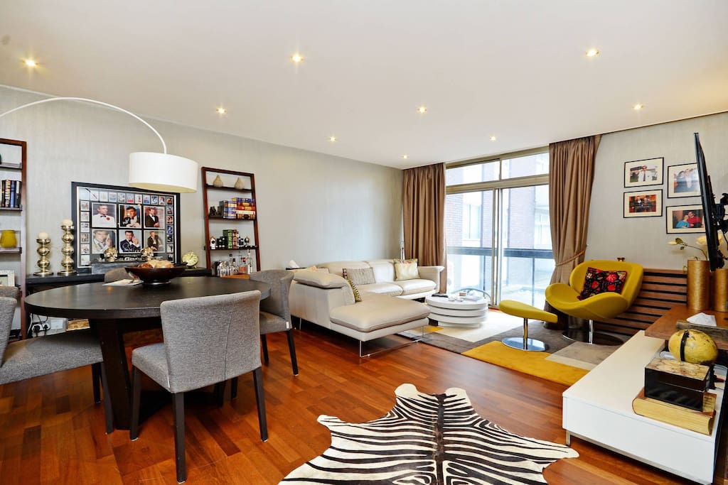 The living room benefits from lots of natural light and a small balcony.