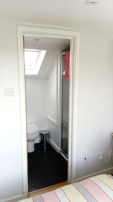 Smart en-suite with shower and lovely view from the velux window.