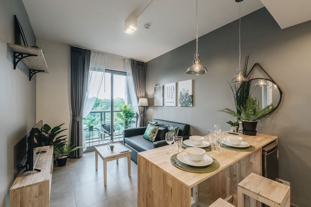 Stylish Green Loft Living Room with Dining table