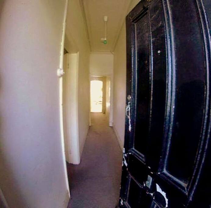Entrance. Room is first door to the left.