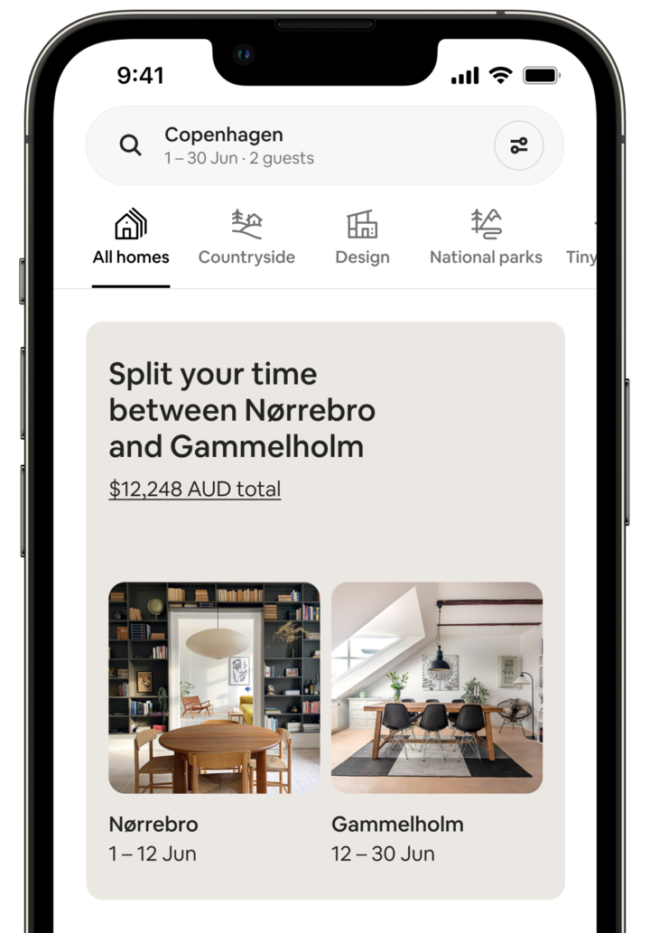 The screen of a mobile phone shows a Split Stay. The screen says: 'Split your time between Norrebro and Gammelholm' and displays the price for the trip. Below, there are two photos of the homes. The Norrebro image shows a dining room with a large charcoal bookcase and a modern chandelier. The Gammelholm image shows another dining room, this one lit by a large skylight. Each photo is captioned with dates, which make clear that the guest would spend 12 days at Norrebro, followed by 18 days at the Gammelhorm home.