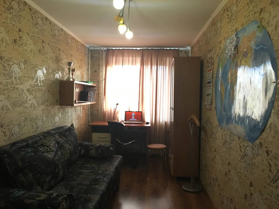 Bedroom with double sofa-bed, wardrobe, bookcase, work table