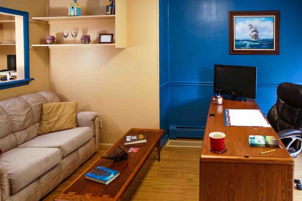Sitting area welcomes you and leads into the bedroom , bathroom and kitchenette.