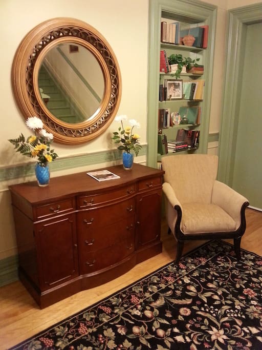 Main floor hallway features a little library from which guests are welcome to borrow books.