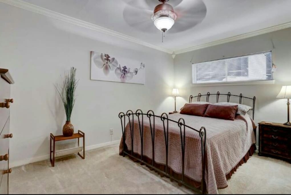 Spacious bedroom with half bathroom.