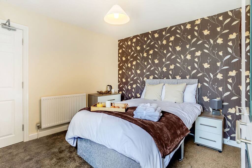 Located on the second floor with chest of drawers and wardrobe.