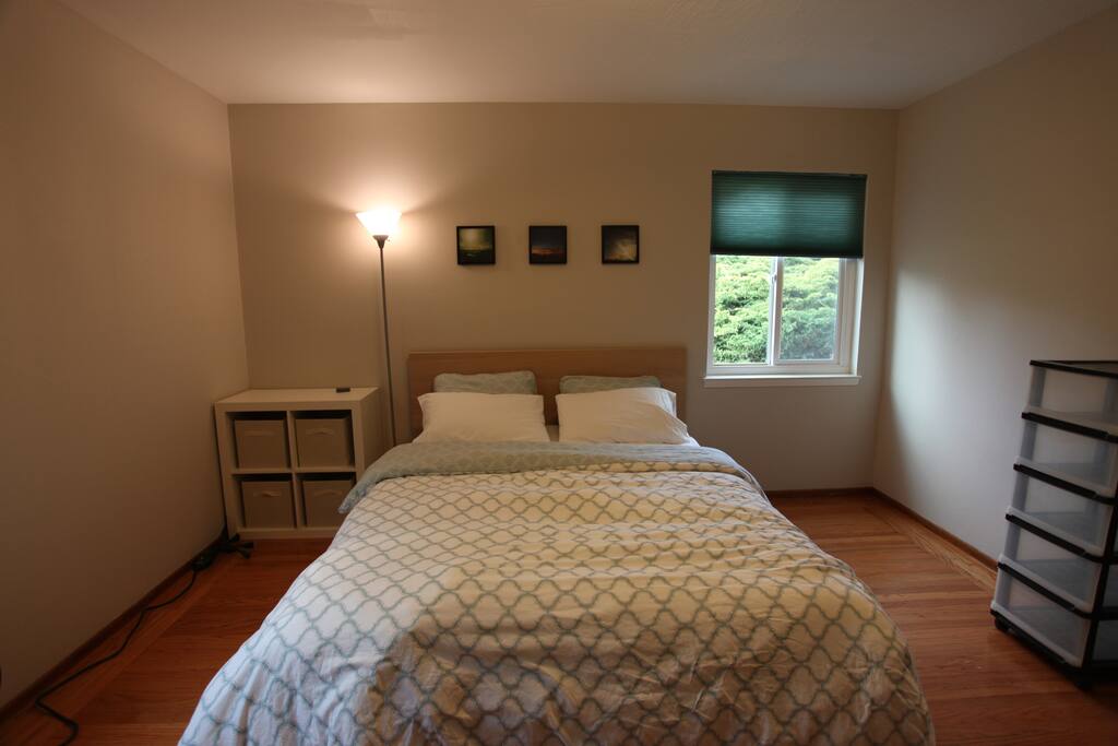 Spacious corner room with closet space and shelving