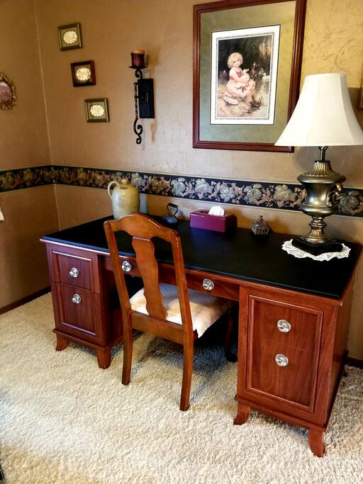 Oversized desk for setting up computer, doing paperwork, etc.