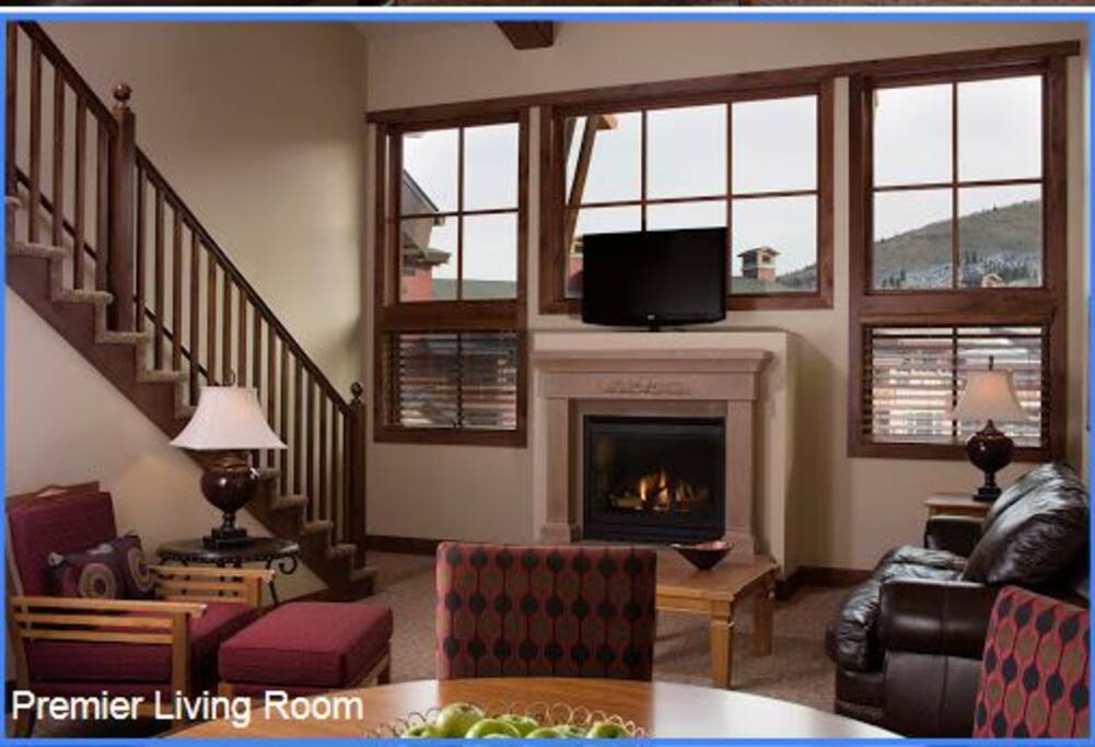 Living Room with stairs leading to bedroom loft and sofa bed