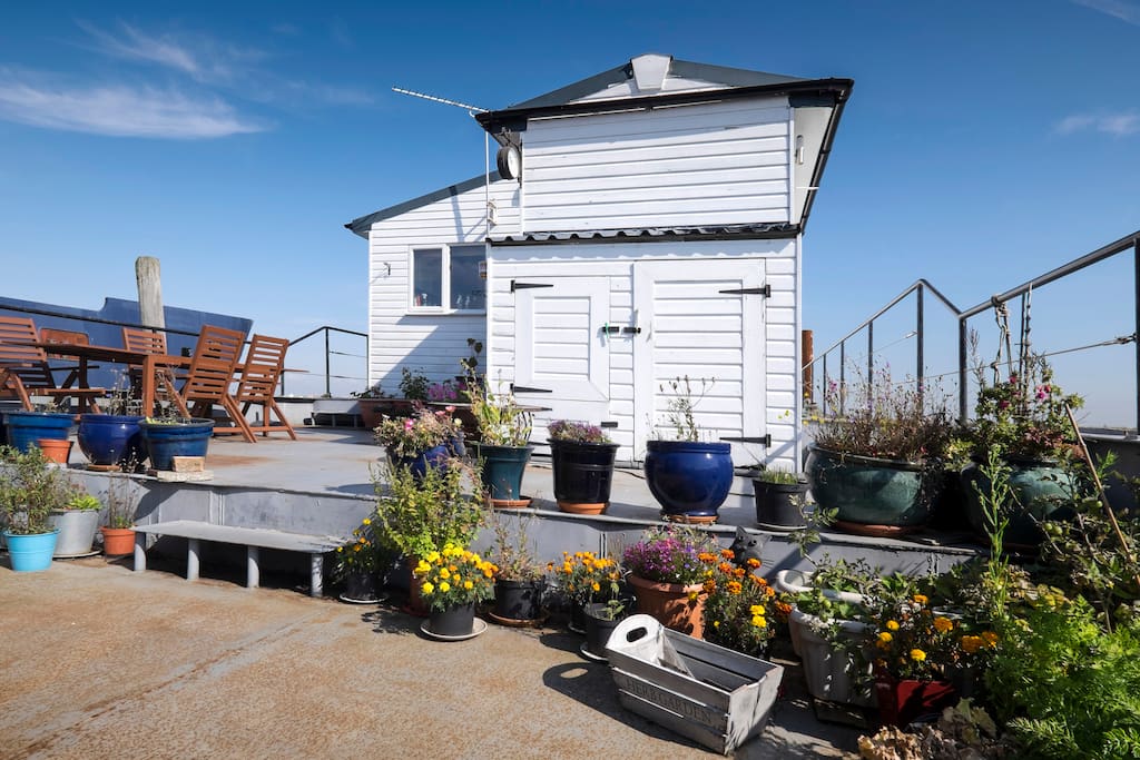 Guests have access to the outside deck with a fire pit, chimnea and a gas BBQ .
