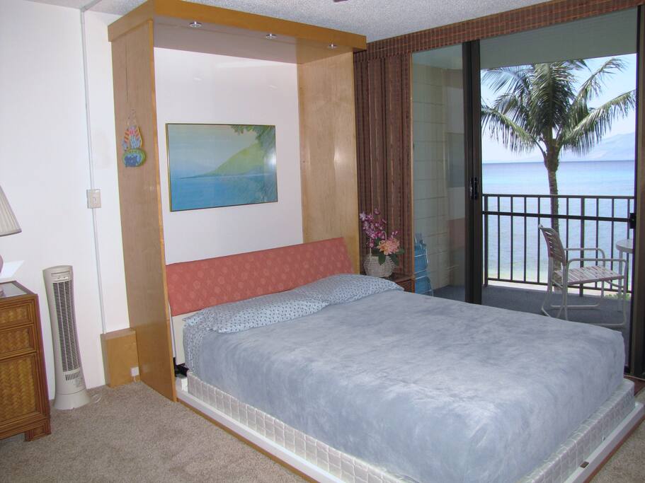 Queen Murphy bed ready for a comfortable night's sleep. Fall asleep to the sound of the waves.