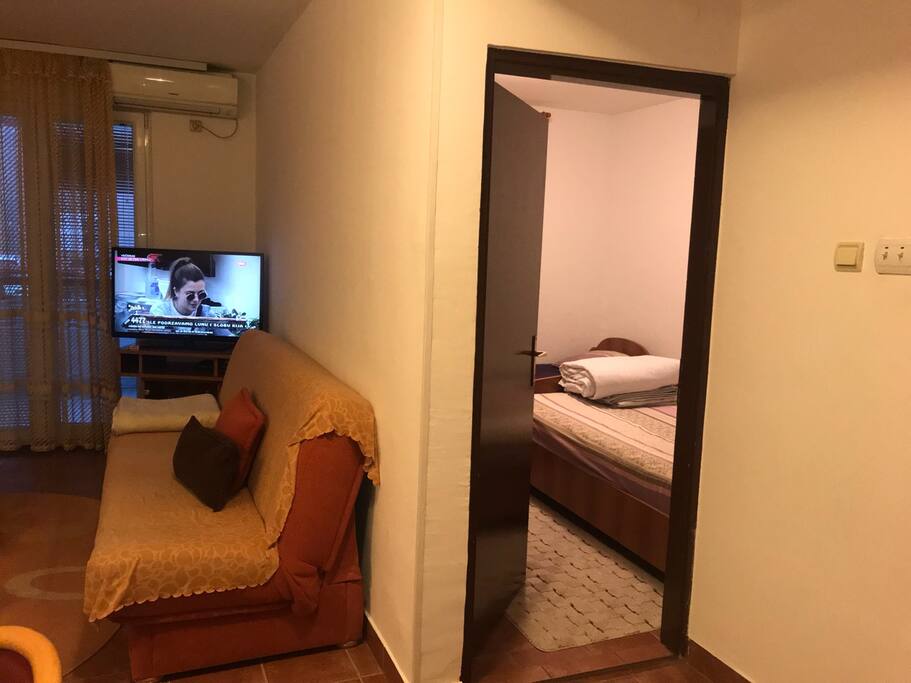 The bathroom is next to the bedroom.
