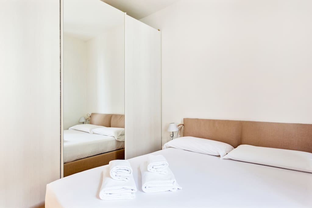 The Bedroom - The comfortable double bed with soft bed-linen and towels