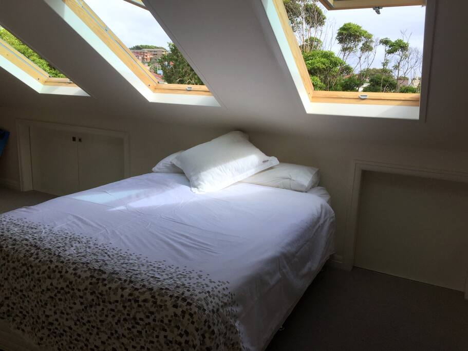 Upstairs ensuite bedroom with sea views and walk in wardrobe