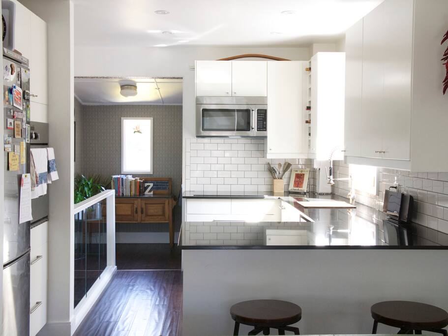 Kitchen equipped with convection oven and an induction stovetop.