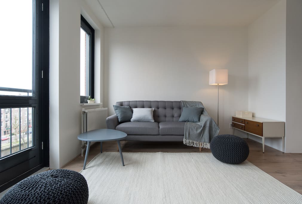 Spacious and comfortable living room, filled with natural light