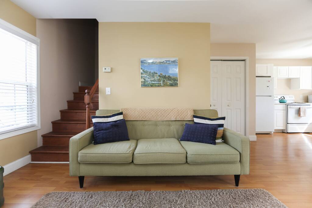 The living room includes the best napping couch around!