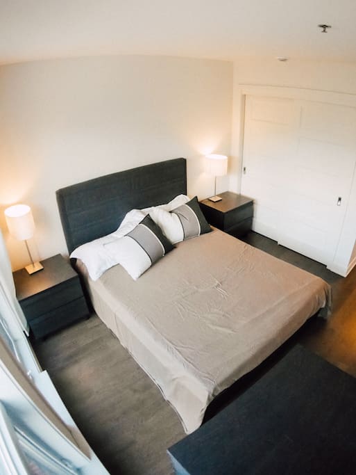 Bedroom 1 w/huge windows, street view