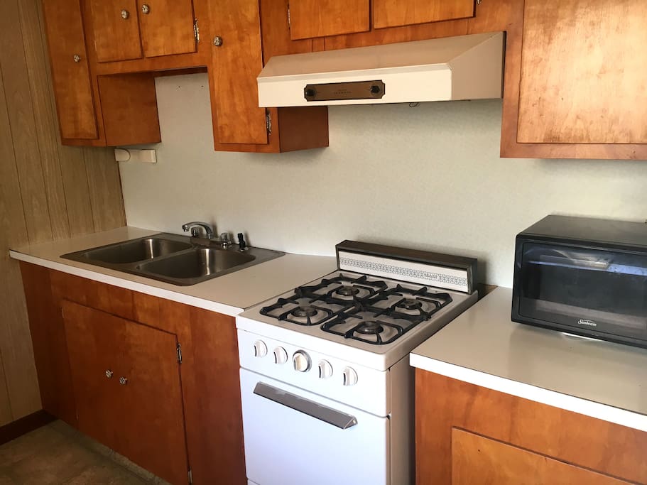 Galley Kitchen with Mini Fridge and Cooking Elements