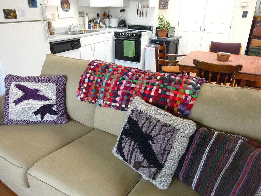 Brand new sleeper sofa with queen-size. Hand hooked pillows.