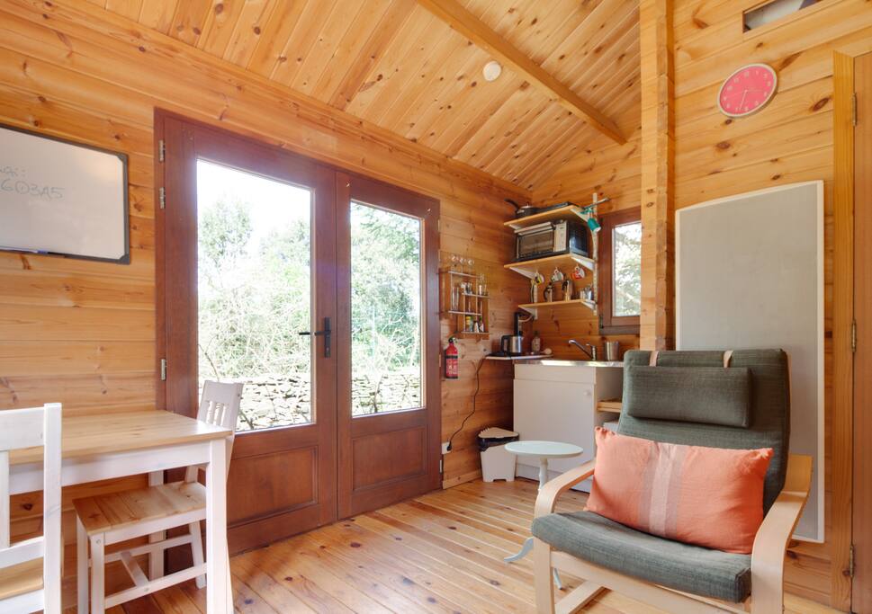 Living area with dining table and corner kitchenette