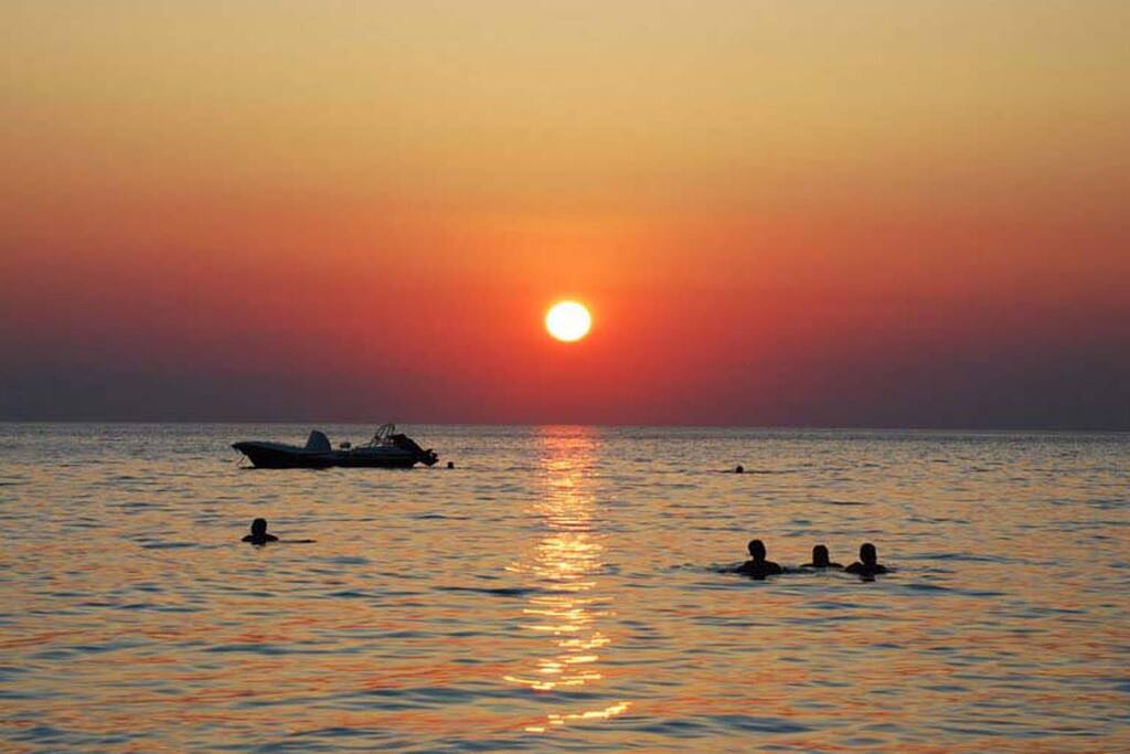 Swim in the clear sea with the sunset