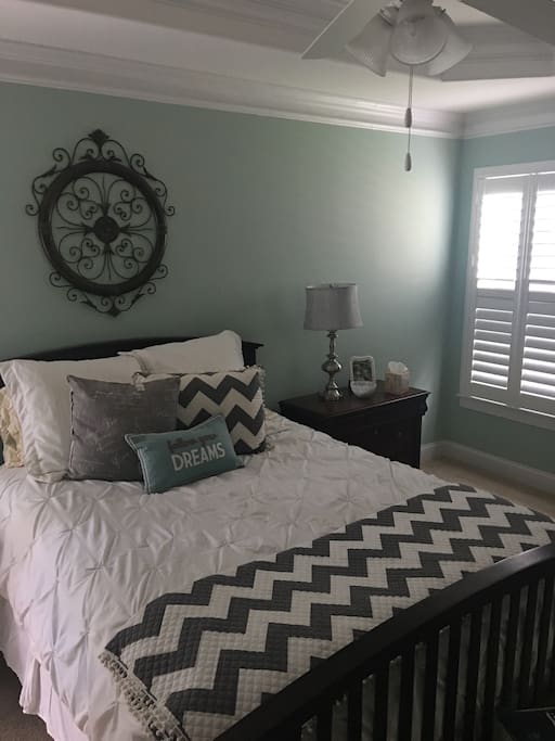 Master bedroom with queen bed on
opposite side of home from the other two bedrooms. Quiet and cozy with ceiling fan and wood shutters