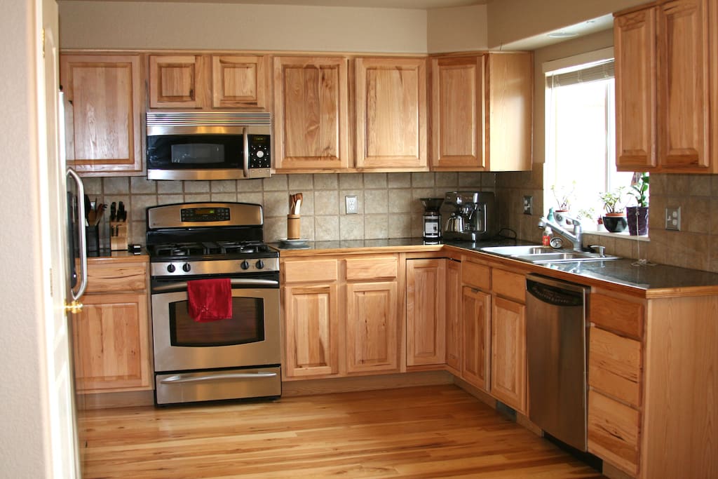 Fully stocked kitchen. Gas range, hickory cabinets and flooring. Stainless appliances.