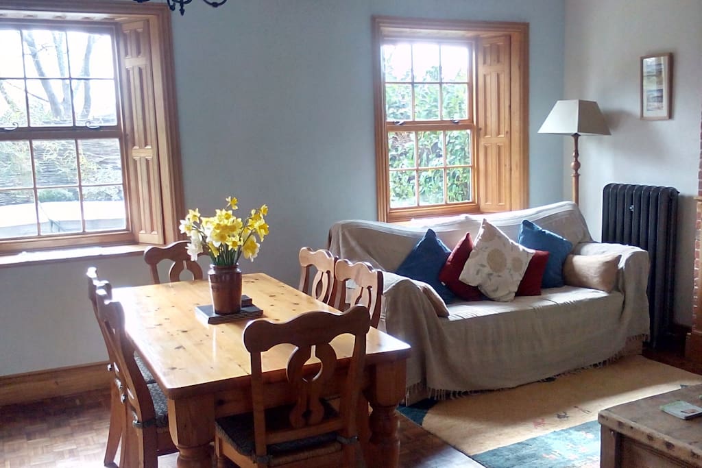 Enjoy the bright south facing living room with windows to be able to look out at your group enjoying the garden, patio and hot tub.