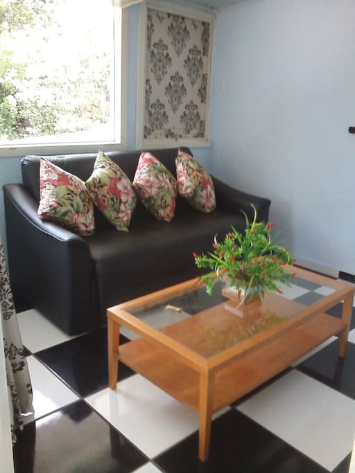 Sala com sofá cama