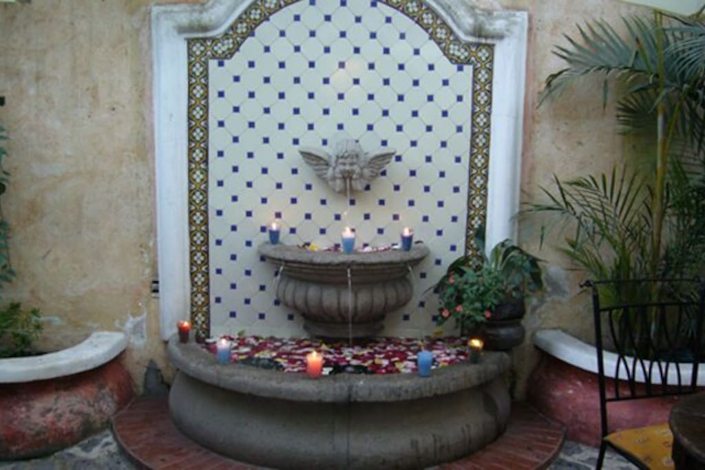 Fountain in front of the apartment private patio.