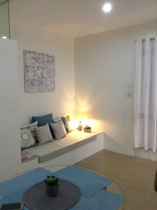 A cozy living room for this quaint 32 sqm condominium unit