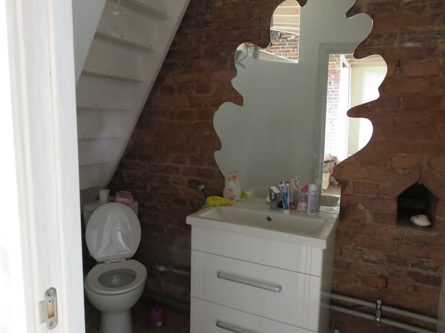 A bathroom under the mezzanine