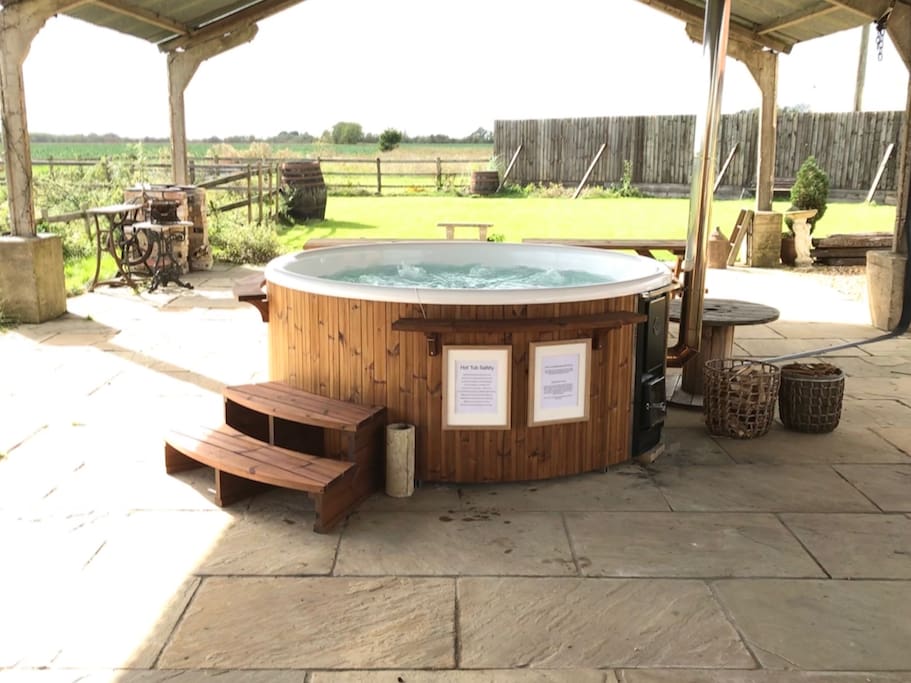 Our beautiful wood burning hot tub with views across open countryside