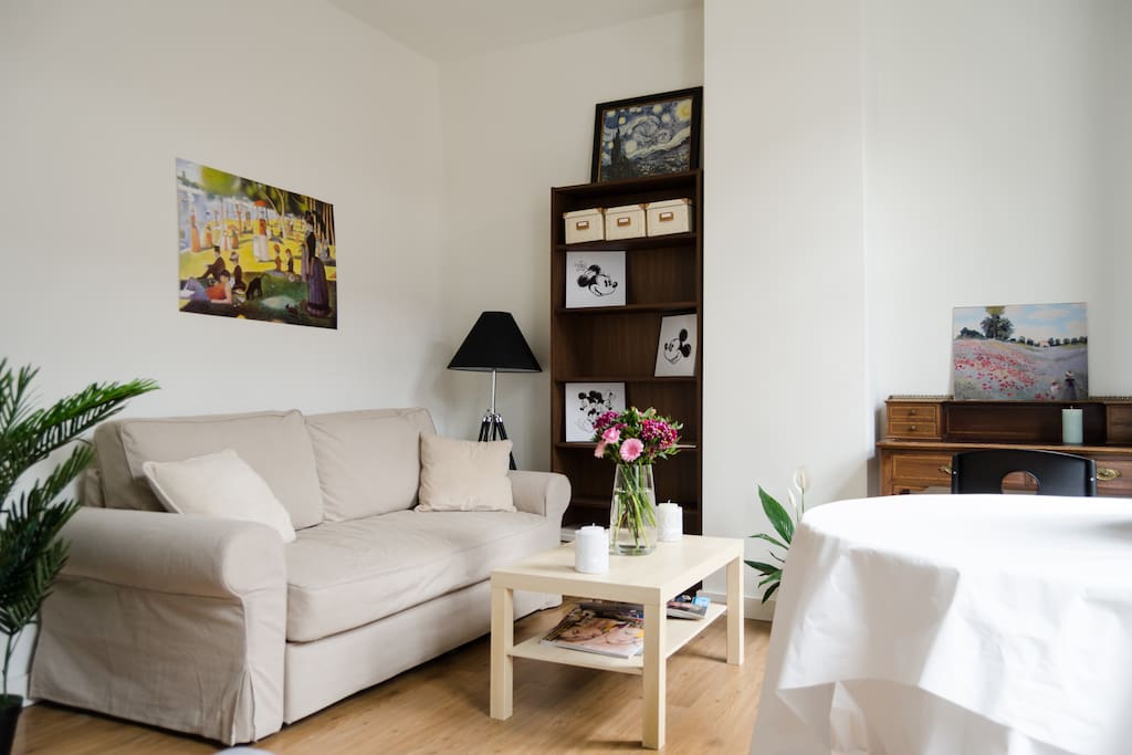 Living room: a place to sit back and relax or do some work behind the desk if needed