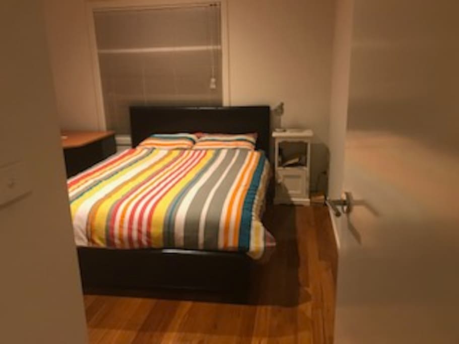 Very comfy Queen bed and desk in room