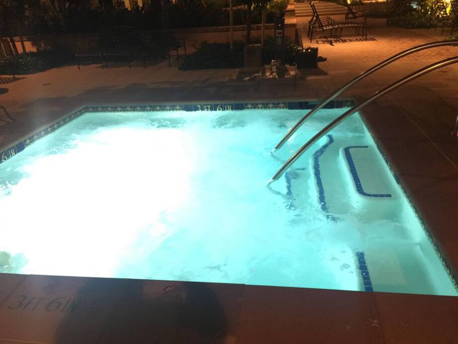 Jacuzzi next to pool.