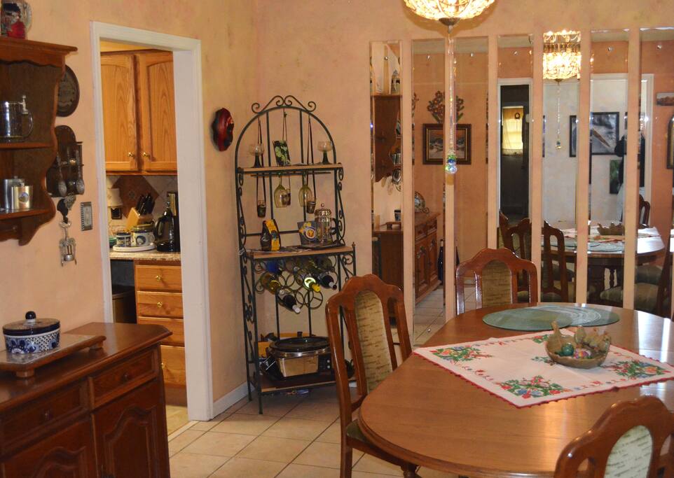 Dining room with European decor, access to kitchen and large table for dining or working on your laptop.