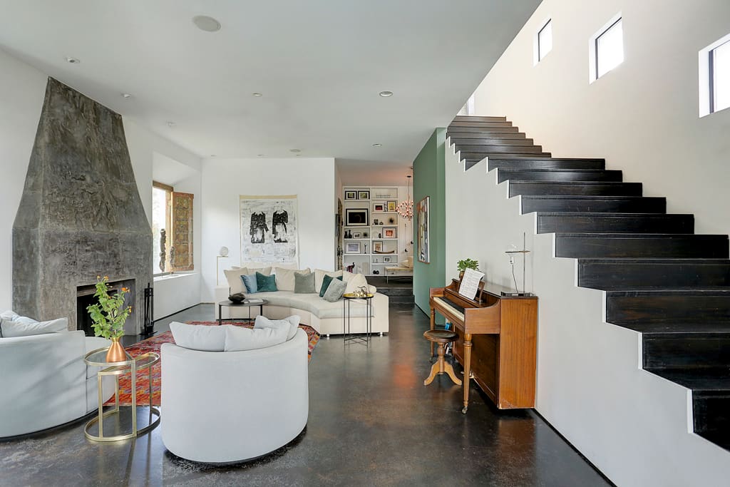The living room has lots of room to relax and enjoy TV and wood burning fireplace.