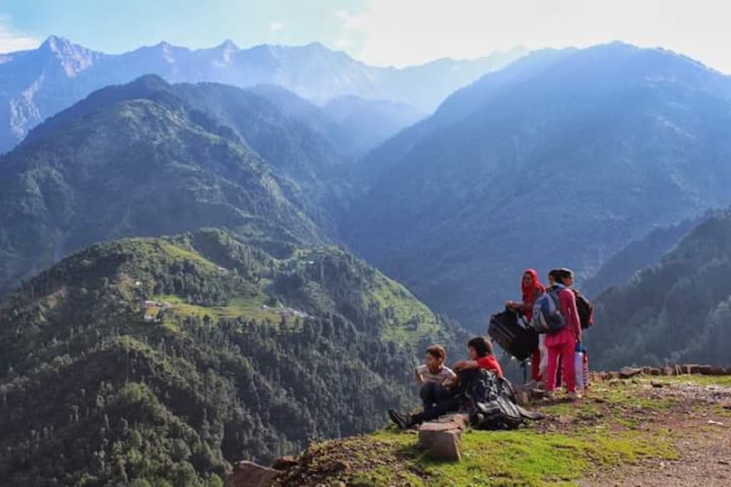 A family group in front of the building enjoying nature beauty before leaving for a trek into the hills