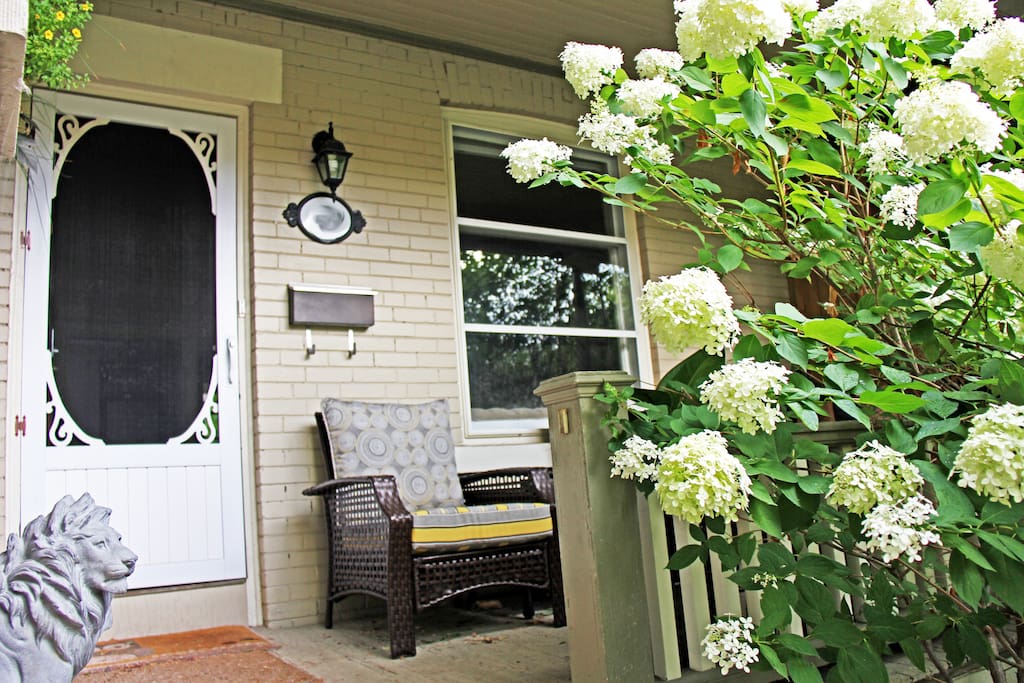 Welcome to your bright main level front entrance! Enjoy your morning coffee or evening glass of wine on the front porch with seating for two.