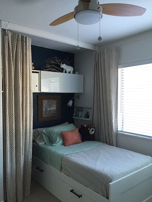 Comfortable twin bed in a "nook" (for single guests)