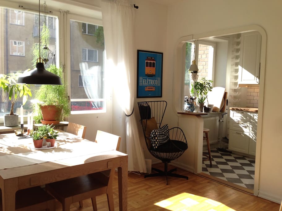 Livingroom, kitchen and door to balcony