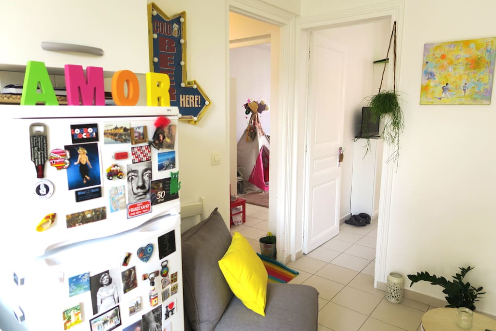 View of the two rooms from the living room -kitchen