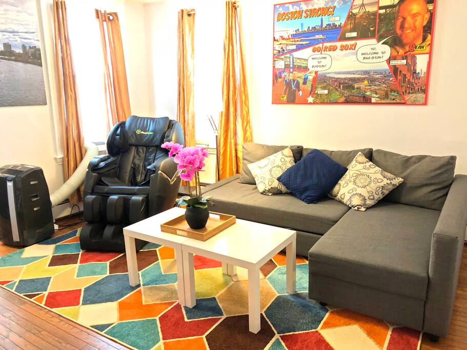 living room, with pull out couch (full size) and the massage chair