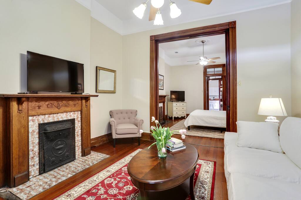 Living room with queen sofa sleeper and flat screen tv.