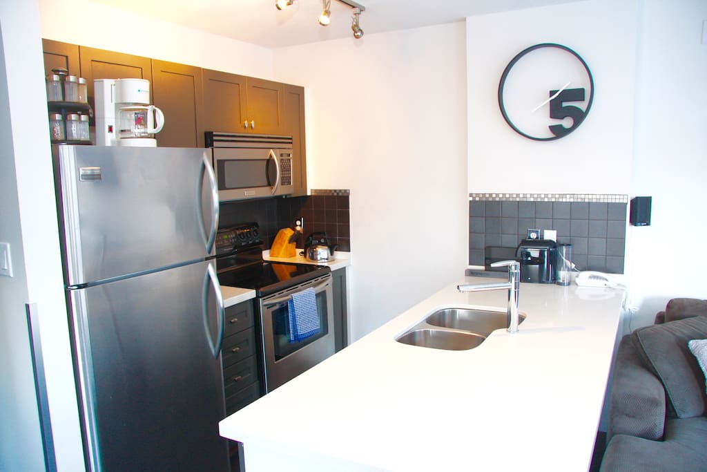 Updated kitchen with stainless steel appliances is equipped with the tools most anyone would need when preparing your meals!