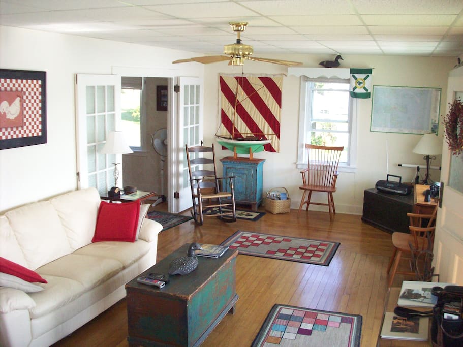 Loon Lodge living room with lots of antique folk art