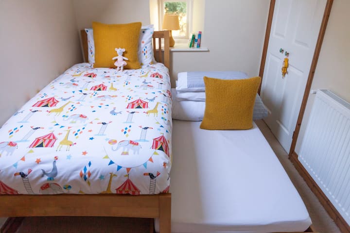 The 2nd single bed is a trundle bed which pulls out and is very comfortable.  It is suitable for both adults and children.